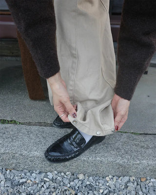 Side-tucked white cotton pants