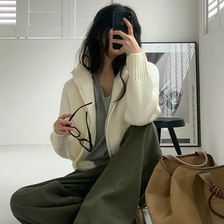 Wide-leg pants with buckle pleats