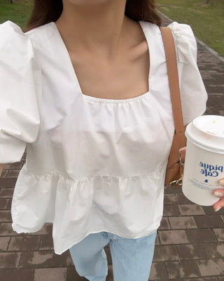 Voluminous peplum blouse