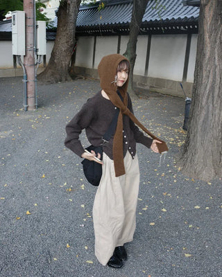 Side-tucked white cotton pants