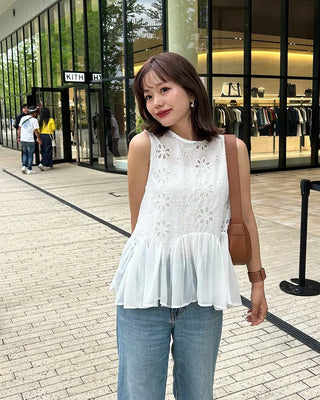 Perforated ruffle sleeveless top