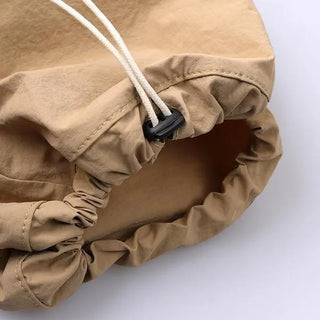Drawstring pocket shoulder bag