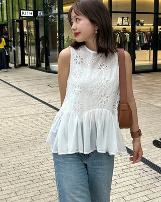 Perforated ruffle sleeveless top