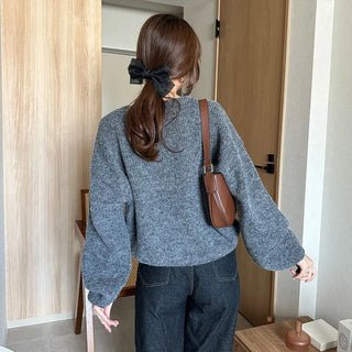 Loose-fitting button-up wool cardigan