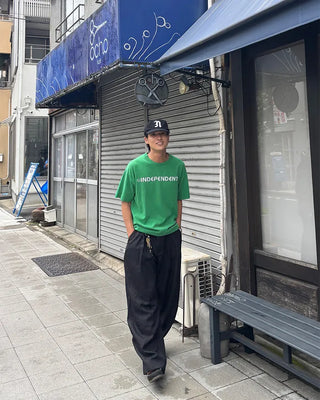 Double-pleated striped slacks
