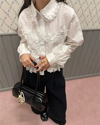 Flower embroidered peplum blouse