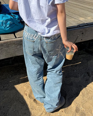 Back lettering denim pants