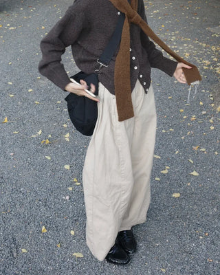 Side-tucked white cotton pants