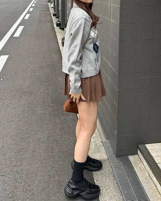 Belted corduroy pleated mini skirt