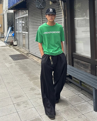 Double-pleated striped slacks