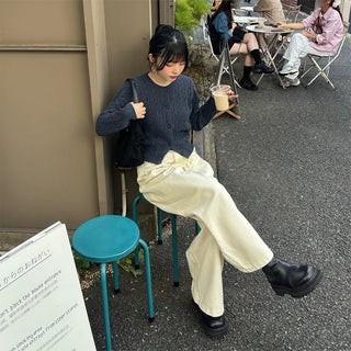 Tucked wide-leg pants