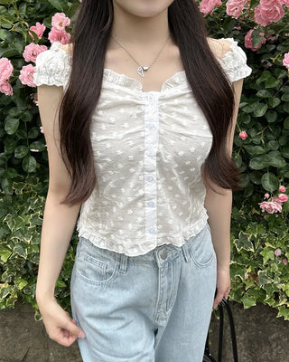 Frilled hem sleeveless blouse