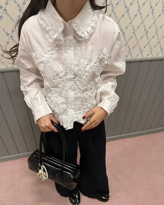 Flower embroidered peplum blouse