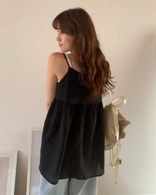 Back-button sleeveless blouse