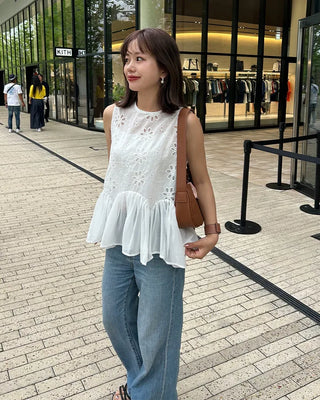 Perforated ruffle sleeveless top