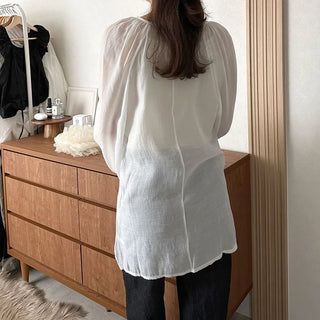Deep V-neck sheer blouse