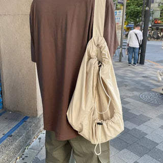Drawstring pocket shoulder bag