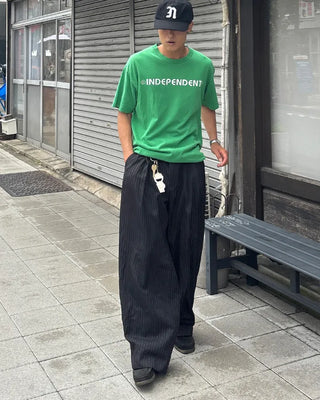 Double-pleated striped slacks