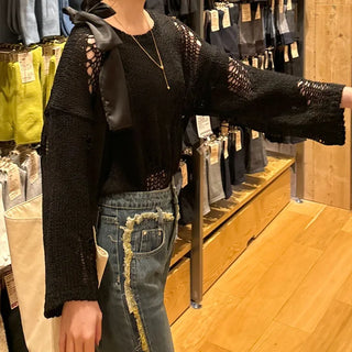 Damaged perforated knit
