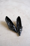 Pointed-toe strap heels
