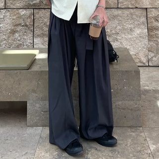 Wide-leg pants with belt and pleats