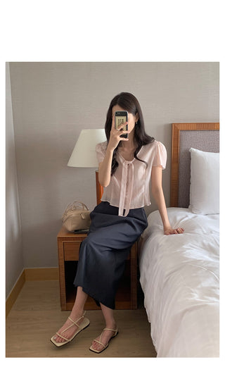 See-through sleeveless blouse