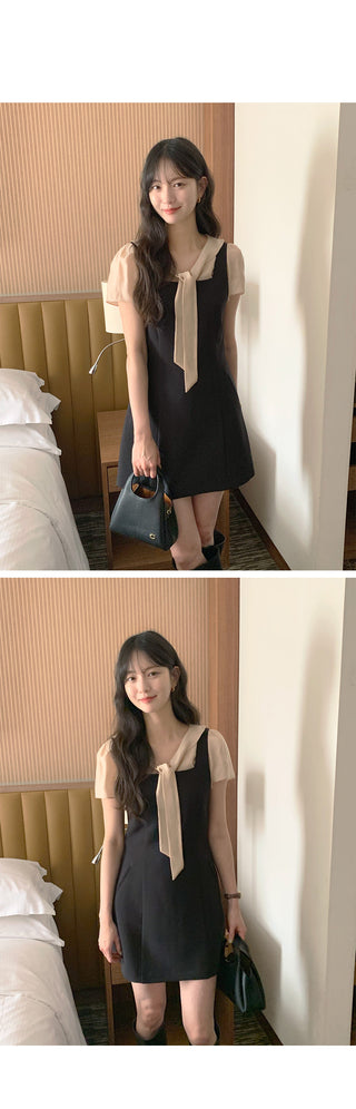 Short-sleeved blouse with tie