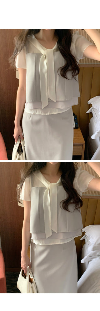 Short-sleeved blouse with tie