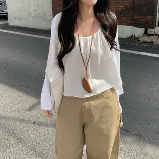 Layered oversized strap sleeveless shirred blouse
