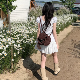 Short-sleeved summer outfit featuring a ruffled collar, puff sleeves, and shirred top.
