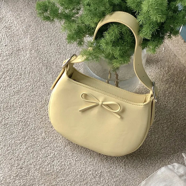 Ribbon buckle round leather shoulder bag