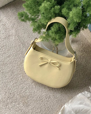 Ribbon buckle round leather shoulder bag