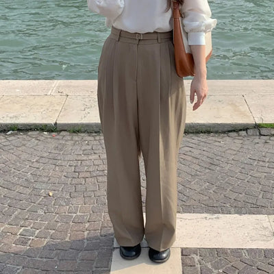 Long wide slacks with belt pleats