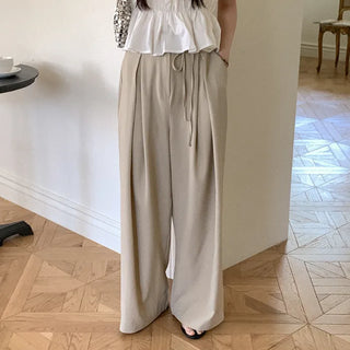 Banding pleated wide slacks with ribbon