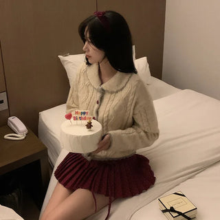 Polka dot ribbon pleated mini skirt