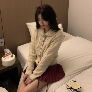 Polka dot ribbon pleated mini skirt