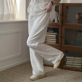 Flower embossed elastic waist pants