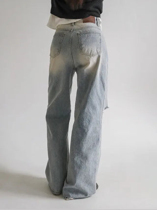 Distressed denim pants