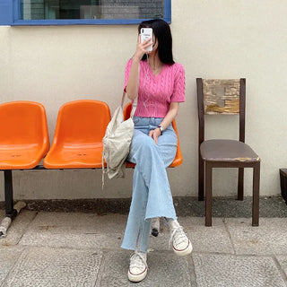 Semi-cropped V-neck pink cable twist puff knit