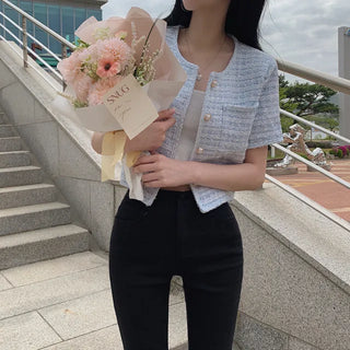 Cropped tweed collarless white jacket