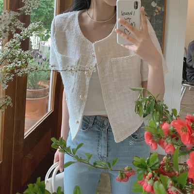 Cropped tweed collarless white jacket