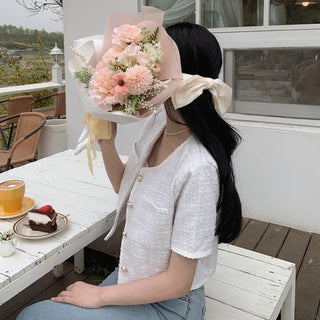 Cropped tweed collarless white jacket