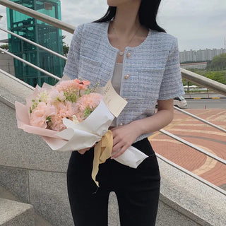 Cropped tweed collarless white jacket