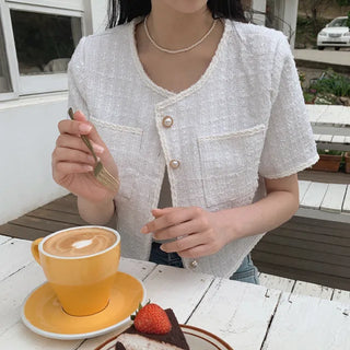 Cropped tweed collarless white jacket