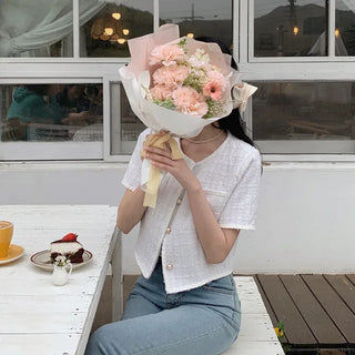 Cropped tweed collarless white jacket