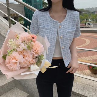 Cropped tweed collarless white jacket