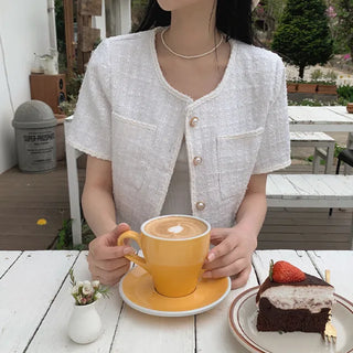 Cropped tweed collarless white jacket