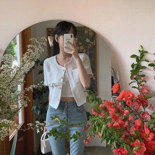 Cropped tweed collarless white jacket