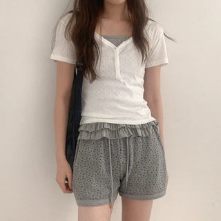 Eyelet punched button short-sleeved T-shirt