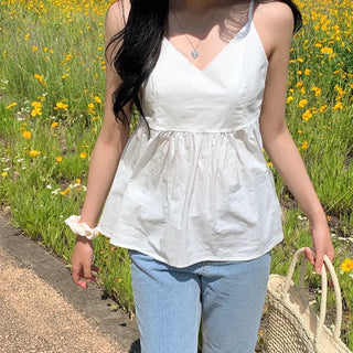 White flared sleeveless bustier blouse